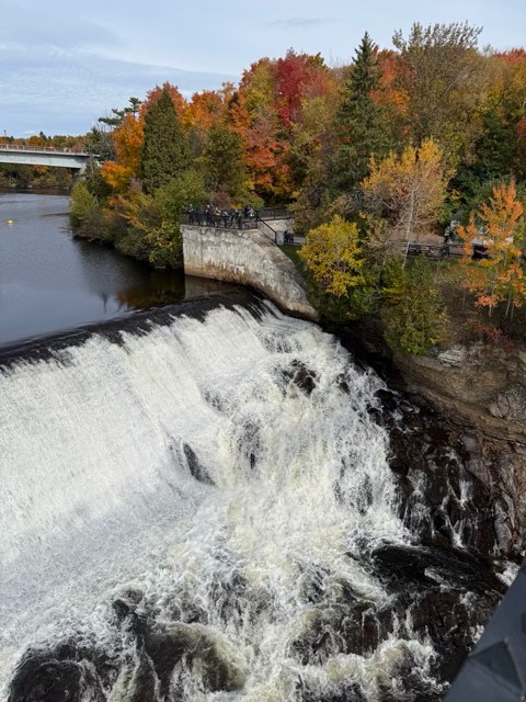 Waterfall surrounded by fall foliage near Quebec City